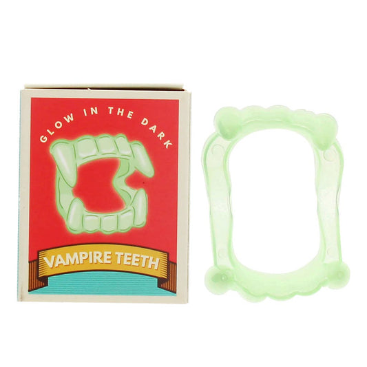 Rex London Vampirzähne aus gelbgrünem Kunststoff mit welligen Rändern, leuchtend im Dunkeln