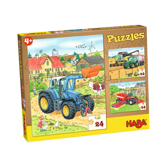 Haba Puzzle-Set Traktor und Co. mit drei Schachteln zu je 24 Teilen, bunte Illustrationen von Landmaschinen auf gelbem Karton