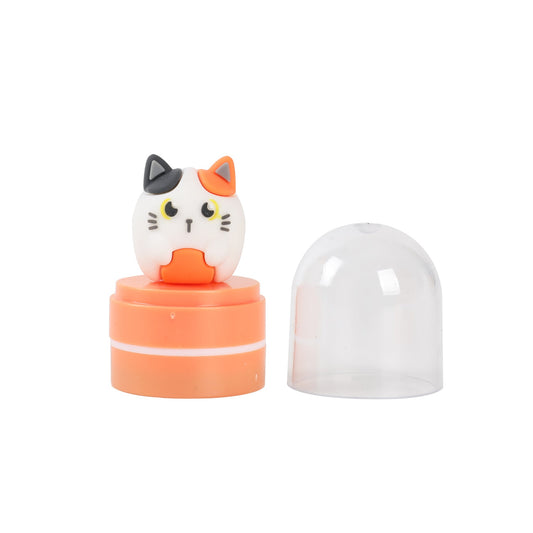 Stempel mit Figur weiße Katze mit orangefarbenen Flecken, Schutzkappe abgenommen daneben