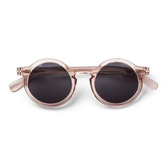 Liewood Darla Junior Sonnenbrille mit runder Form und transparentem rosa Rahmen aus Polycarbonat