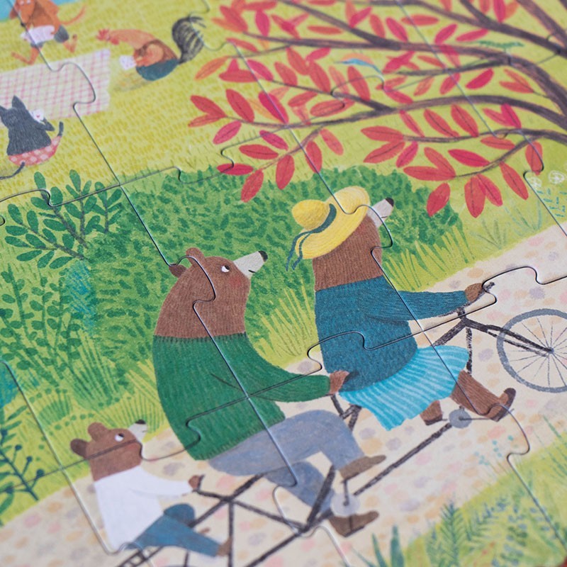 Londji Once Upon a Time Puzzle, Detail mit zwei Bären auf einem Tandem unter einem Baum mit roten Blättern