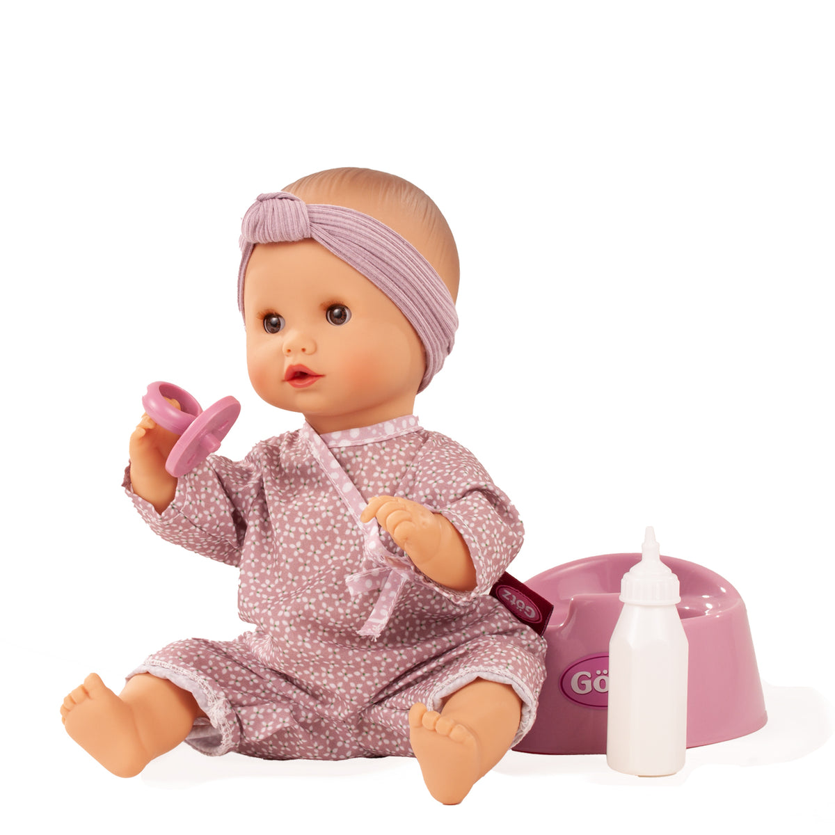 Götz Sleepy Aquini Girl im rosa gepunkteten Strampler mit Schnuller, neben Topf und Flasche