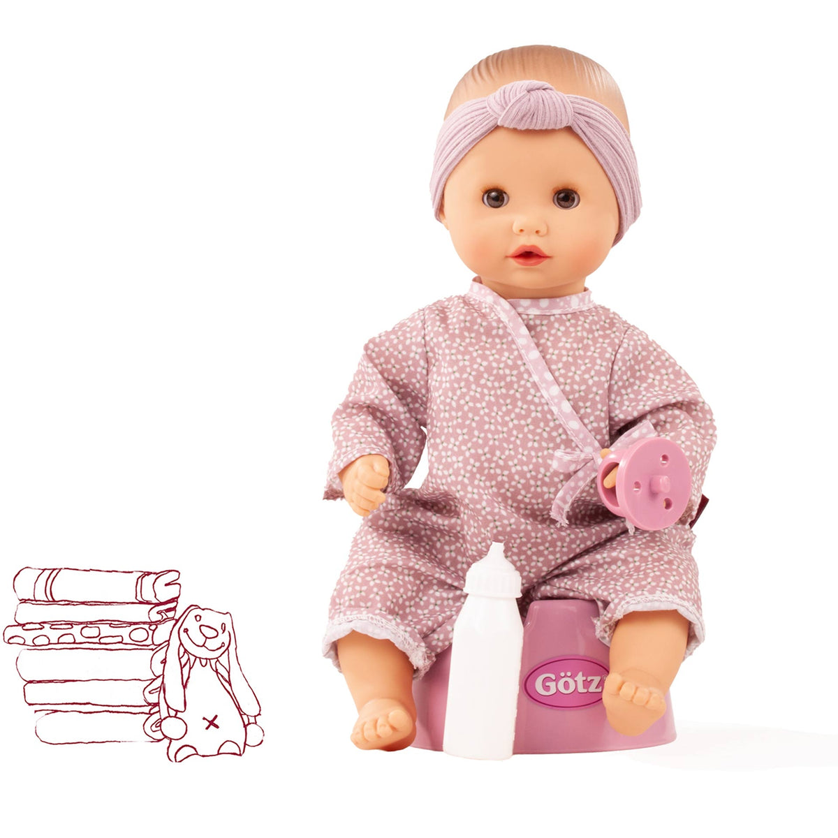 Götz Sleepy Aquini Girl Soft Mood mit lila Stirnband und altrosa gemustertem Overall, sitzt auf dem rosa Töpfchen