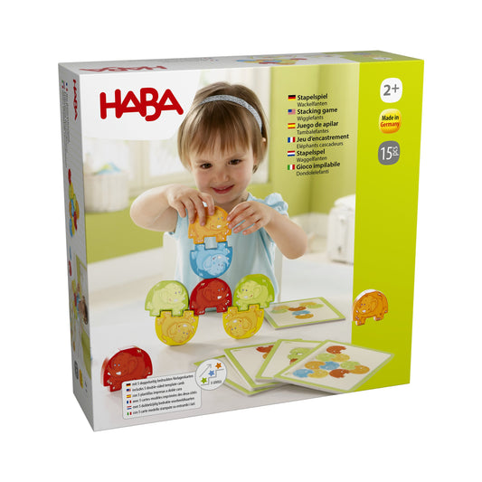 Haba Stapelspiel Wackelfanten Verpackung mit Kind, das bunte Elefanten-Bausteine mit Muster aufeinander stapelt