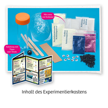 Kosmos Schleim-Galaxie Experimentierset mit orangener Flasche, Glasperlen, Farbpulvern und Anleitung auf blauem Untergrund