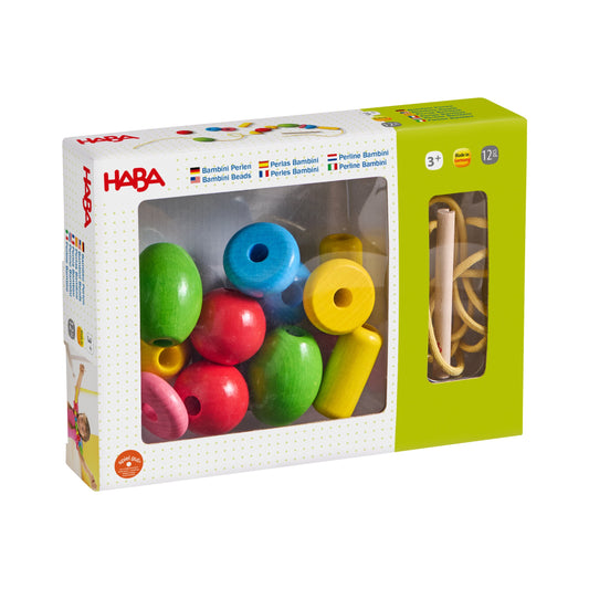 Haba Bambini Perlen Fädelspielzeug Packshot mit bunten Holzperlen und Holzfädel in Karton