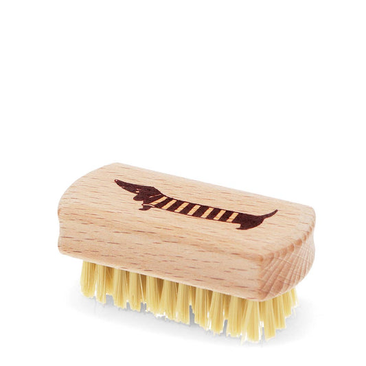 Rex London Mini-Nagelbürste aus Holz mit gelblichen Borsten, auf dem Deckel ein braunes Dackel-Motiv