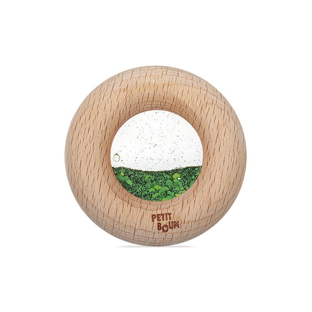 Petit Boum Calm Donut aus Holz mit durchsichtigem Fenster, darin grüner und weißer Glitzer