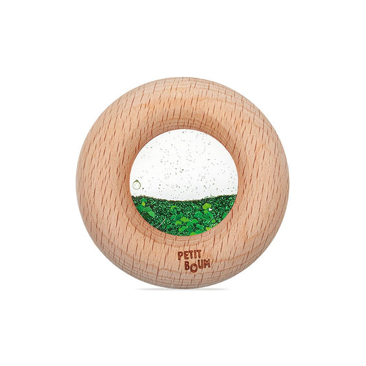 Petit Boum Calm Donut aus Holz mit durchsichtigem Fenster, darin grüner und weißer Glitzer
