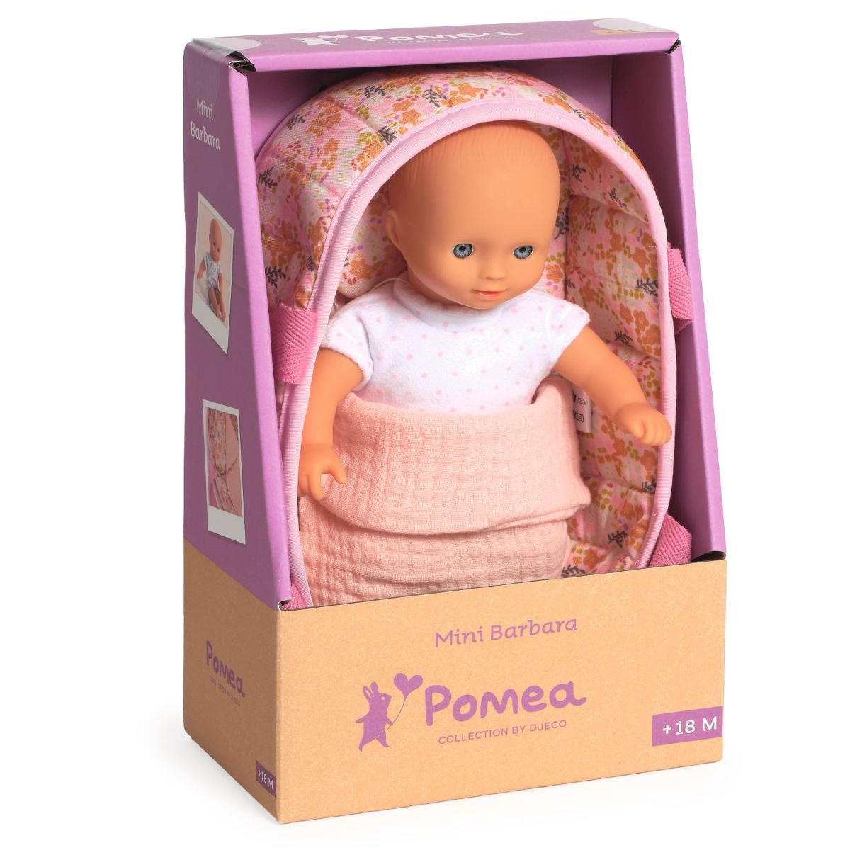 Pomea Mini Barbara Verpackung mit Puppe im weißen Shirt, liegend im rosa geblümten Moses-Körbchen