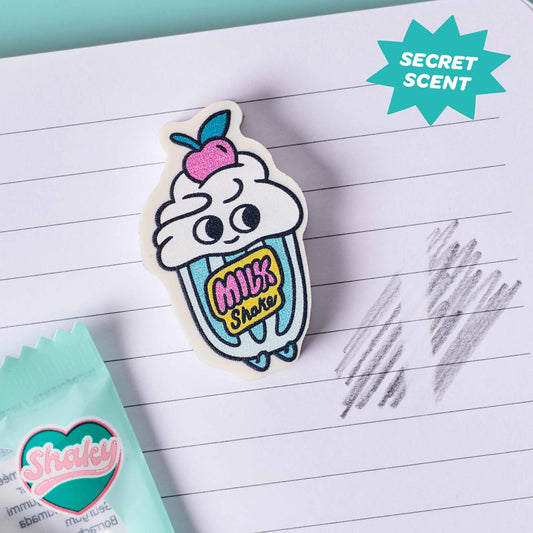 OMY Eraser Buddies Shaky, Radierer als Milchshake-Becher mit Sahnehaube und Kirsche auf Notizpapier