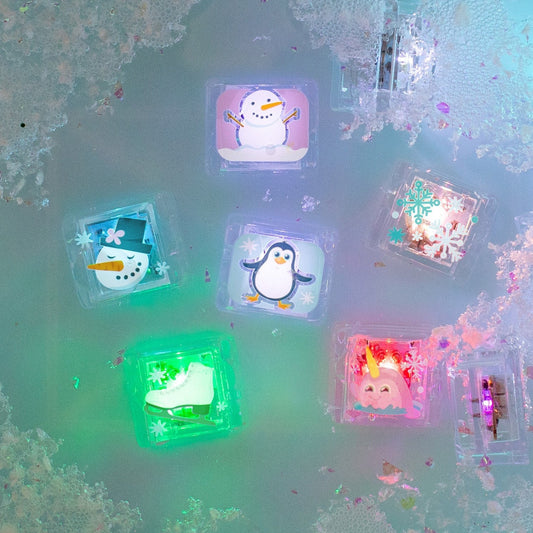 Glo Pals Leuchtwürfel im 6er-Pack mit leuchtenden Wintermotiven in Blau, Grün, Pink und Violett