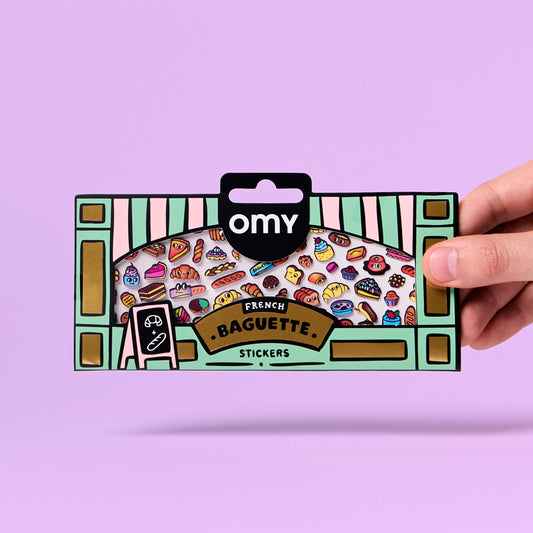 Omy Stickerbogen French Baguette mit bunten Lebensmittel-Motiven, gehalten vor rosa Hintergrund
