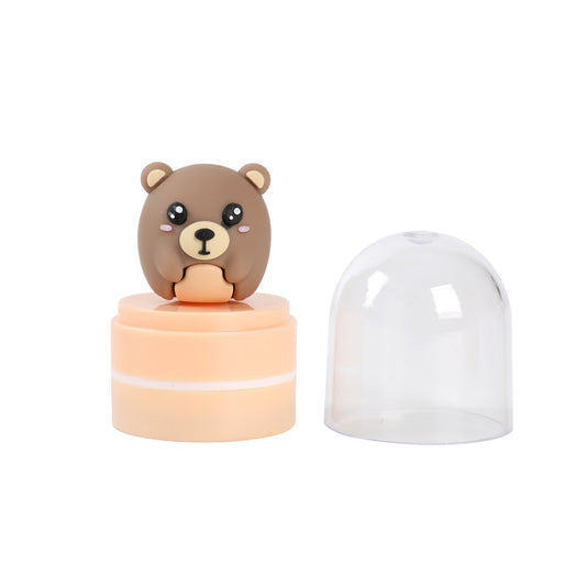 Stempel mit Figur Bär, Schutzkappe abgenommen daneben
