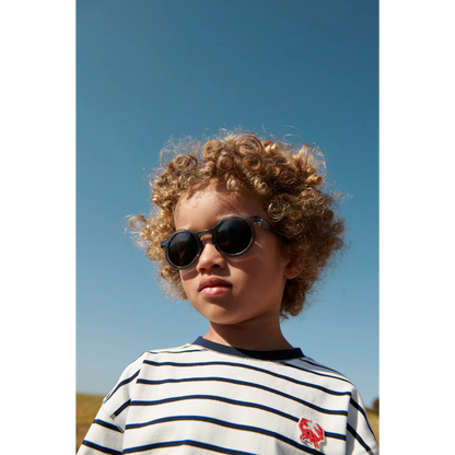 Kindersonnenbrille DARLA von Liewood mit rundem Rahmen aus transparentem Polycarbonat in Blau
