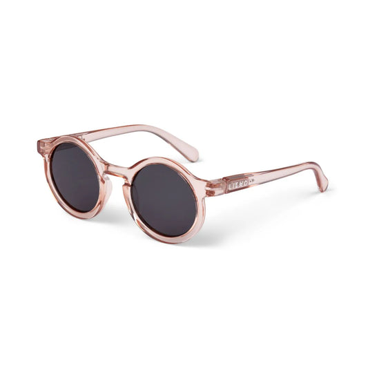 Liewood Darla Junior Sonnenbrille mit runder Form und transparentem rosa Rahmen aus Polycarbonat