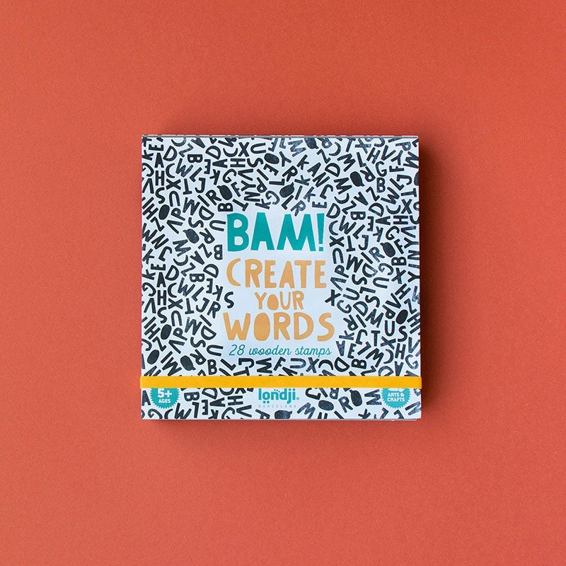 Verpackung des Londji Stempelsets BAM! Create Your Words mit weißem Muster und bunten Lettern auf orangefarbenem Untergrund