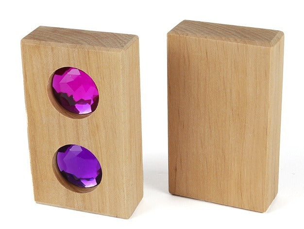 Bauspiel Funkeldach, Vorderseite mit zwei Funkelsteinen in Pink und Violett, daneben die glatte Rückseite