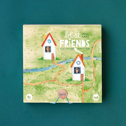 Verpackung des Londji Best Friends Spiels mit zwei weißen Häusern, Wegen und grüner Wiese auf pastellfarbener Illustration