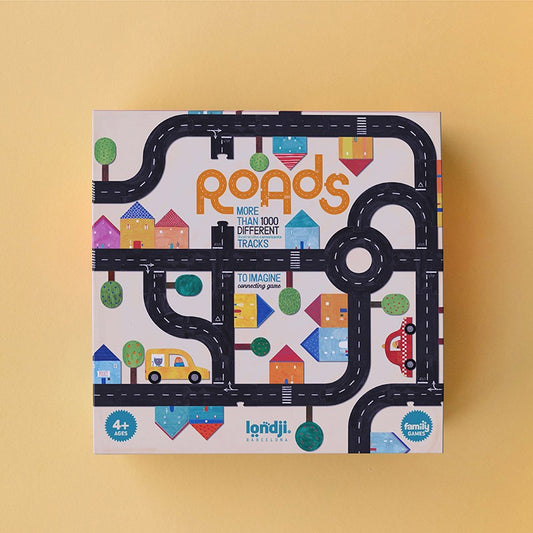 Londji Roads Verpackung mit schwarzen Straßen, bunten Häusern, Bäumen und Fahrzeugen auf Creme-Grund