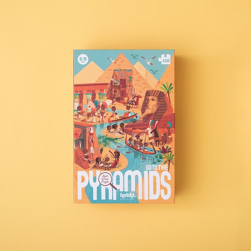 Verpackung des Londji Puzzles Go to the Pyramids mit bunten Illustrationen von Pyramiden, Oasis und Menschen in Ägypten