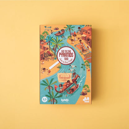 Londji Go to the Pyramids Puzzle 100, Verpackung mit ägyptischen Motiven auf gelbem Untergrund