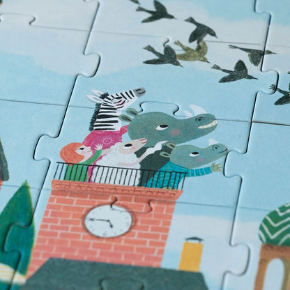 Londji Look Up Puzzle, Zebra und zwei grüne Tiere mit Schals auf einem Backsteinturm mit Uhr, darüber Vögel