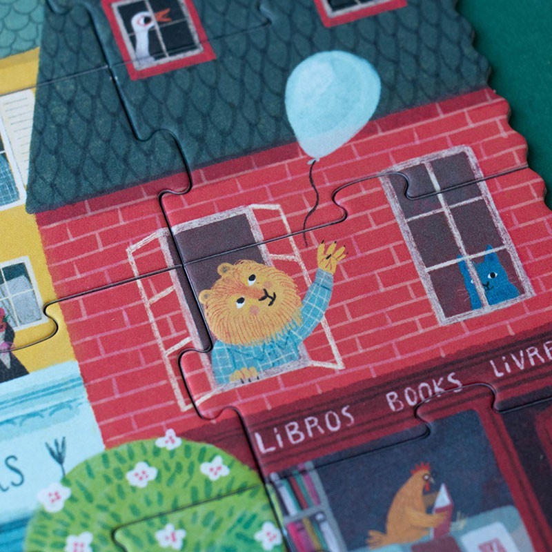Londji Look Up Puzzle, Figur im Fenster eines roten Backsteinhauses hält einen hellblauen Ballon