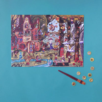 Londji Magic World Puzzle zusammengesetzt mit Stift und kleinen runden Spielsteinen auf türkisblauem Hintergrund