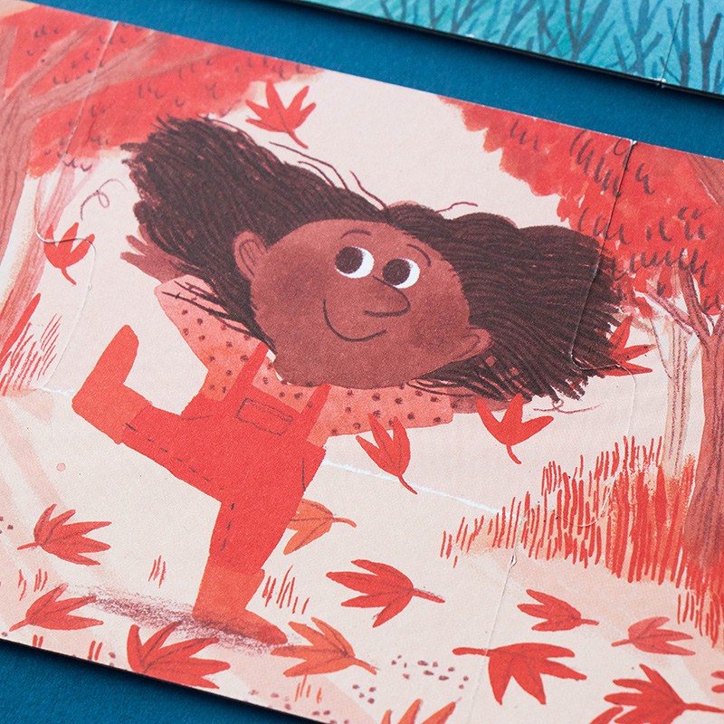 Londji My Colours: Rückseite in Rot, ein Mädchen tanzt zwischen roten Blättern