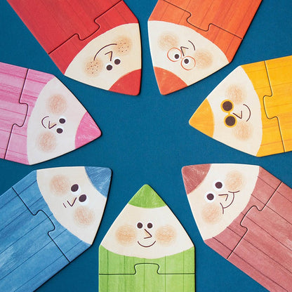 Londji My Colours: Buntstiftspitzen mit Gesichtern als Puzzleteile im Kreis gelegt