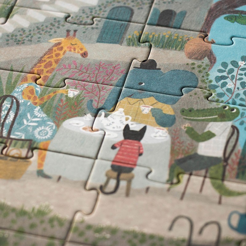 Londji Tea by the Sea Puzzle, Detailaufnahme mit teils zusammengesetzten Teilen, Giraffe, Kind und Strandszene