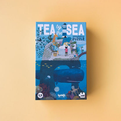 Londji Puzzle Tea by the Sea Verpackung mit Strandszene oben, Wal und Meerestieren unten, 100 Teile