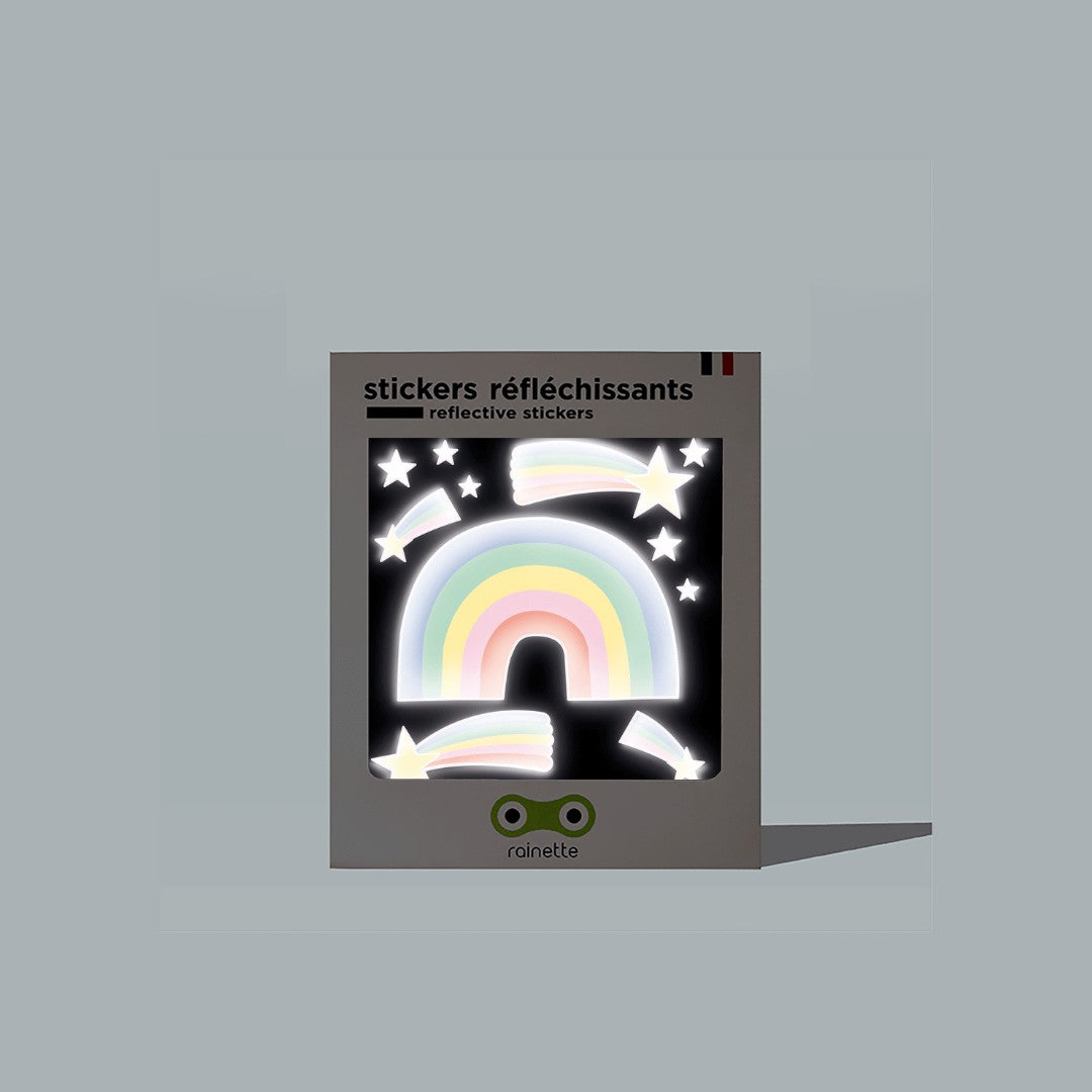 Verpackung der Rainette Reflektierende Sticker mit Regenbogen und Sternen auf schwarzem Hintergrund, Rainette Logo unten