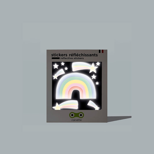 Verpackung der Rainette Reflektierende Sticker mit Regenbogen und Sternen auf schwarzem Hintergrund, Rainette Logo unten