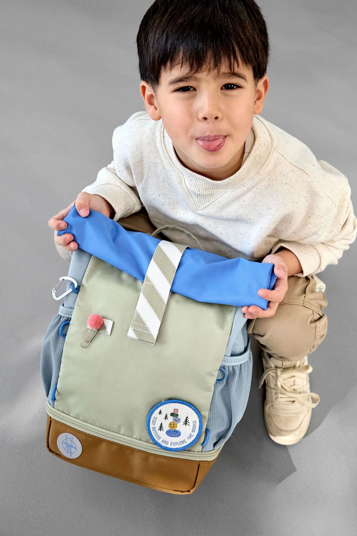 Lässig Kindergartenrucksack Rolltop Sunny Explorer in Grün und Blau mit Explorer-Motiv